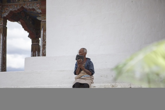 Old Man Listening Radion in Temple