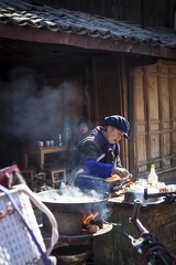 Naxi woman cooking