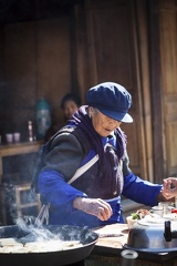 Naxi woman cooking