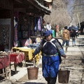 naxi woman carrying water